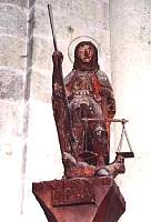 The ancient wooden staty of Saint Michaelin the basilica
